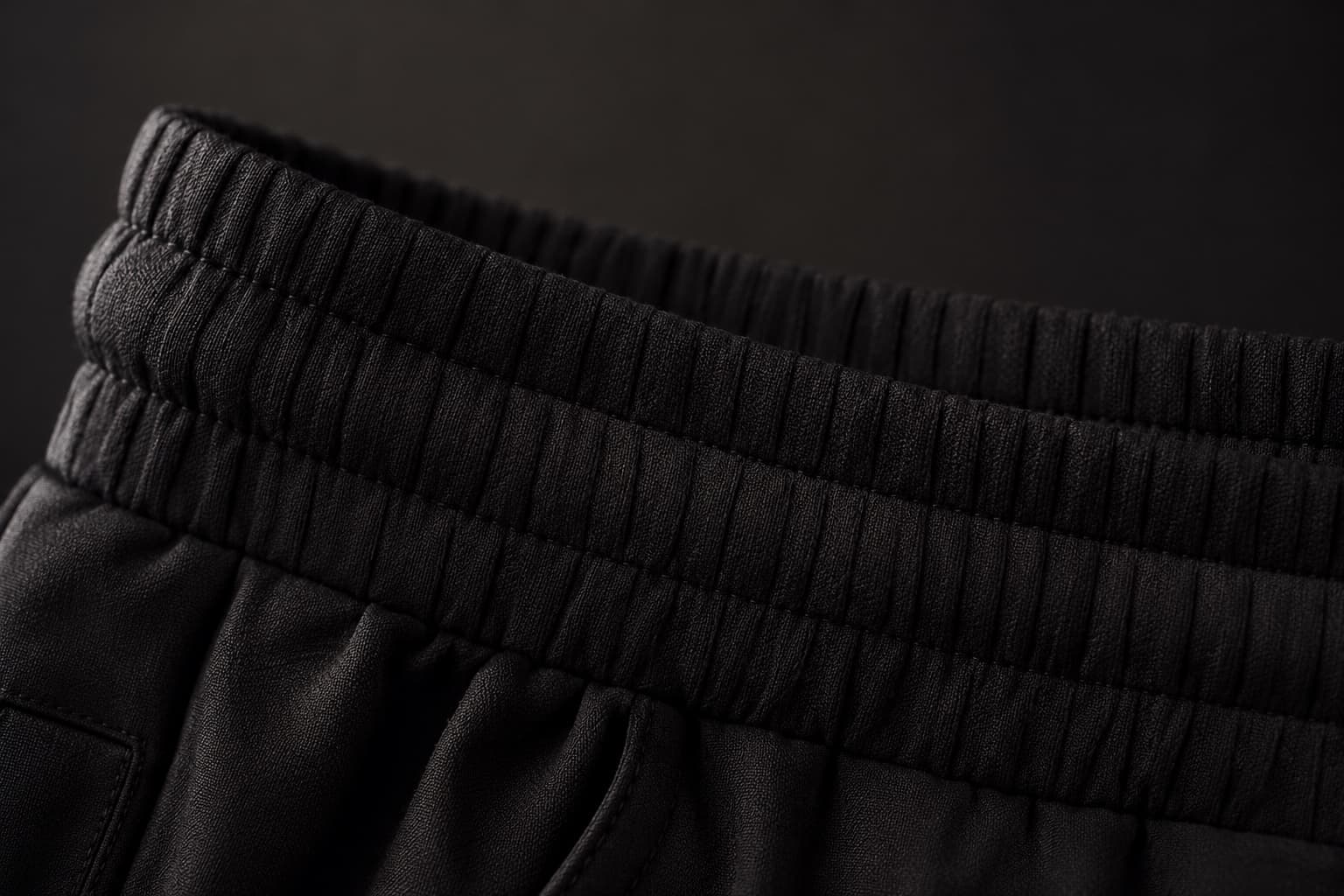 Macro detail of the natural rubber waistband.